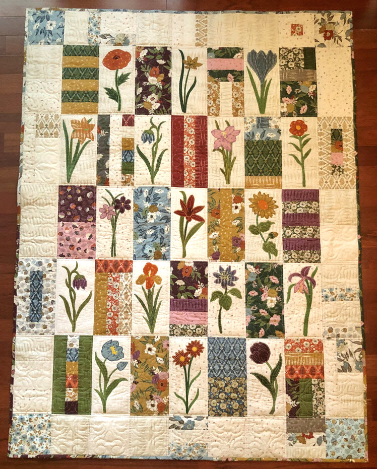 CCQ_Pieced_Filler_Quilt_blocks_Combined_with_raw_edge_flower_applique_748by931.jpg